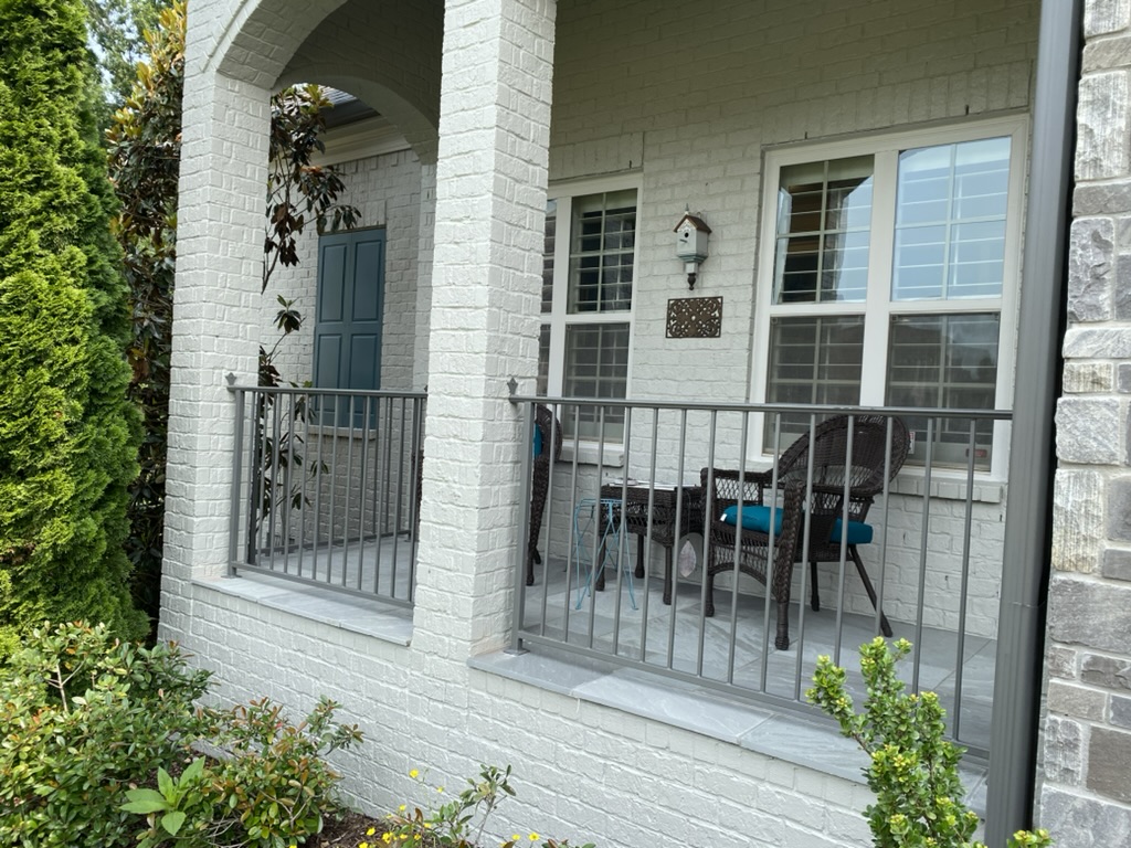 silver wrought iron fence in nashville around front porch