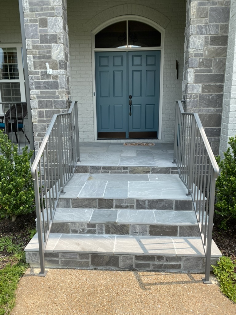 silver wrought iron fence in nashville going down steps